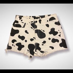Cow print denim shorts